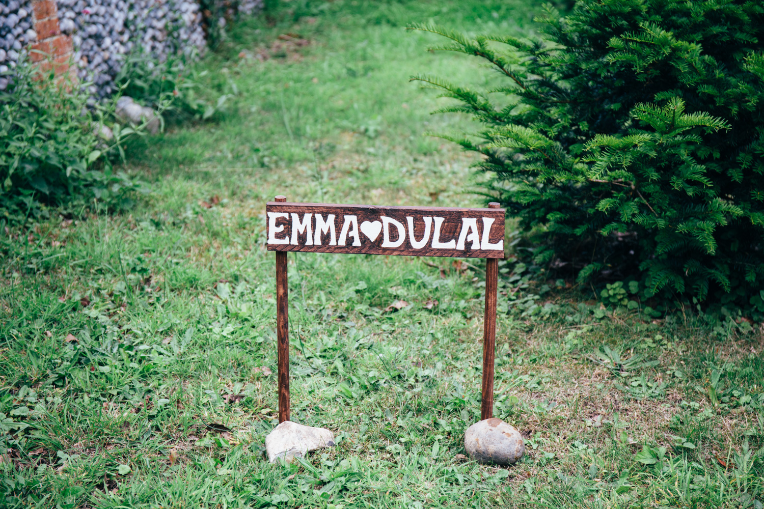 Emma and dull wedding sign at chaucer barn