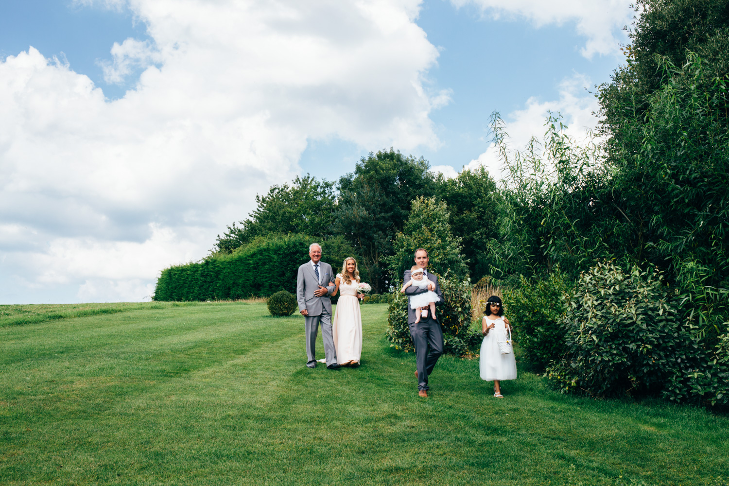 wedding photography of bridal party and chaucer barn outdoor ceremony