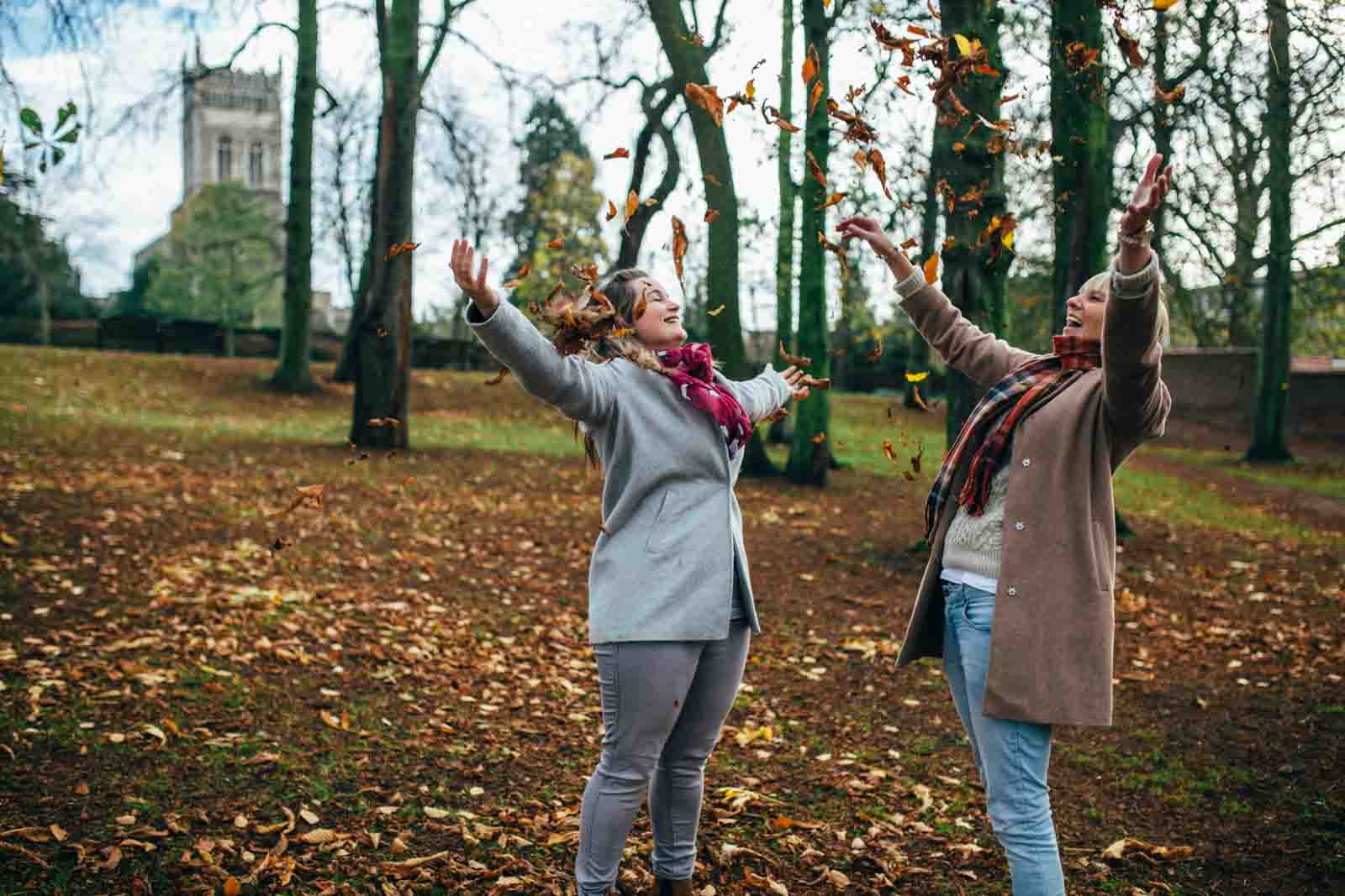 autumn leaves throwing couples shoot in suffolk