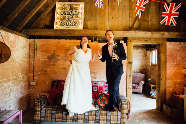 bride and groom standing on the sofa at the keeper and the dell