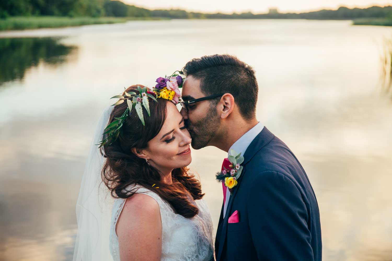 newlyweds couple in love by the water at Boathouse Ormesby Wedding Photographer