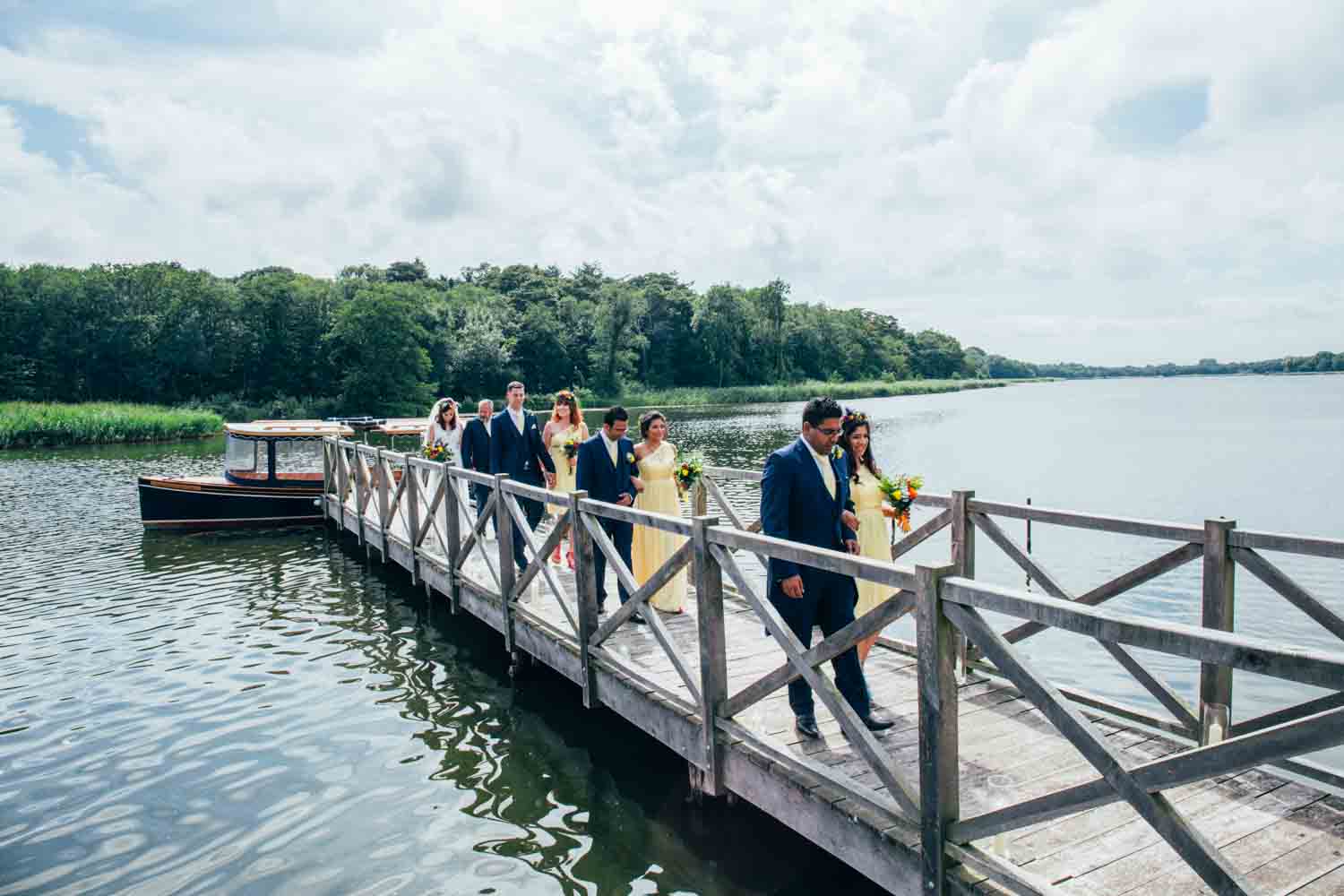 bridesmaids and groomsmen entrance at Boathouse Ormesby Wedding Photographer