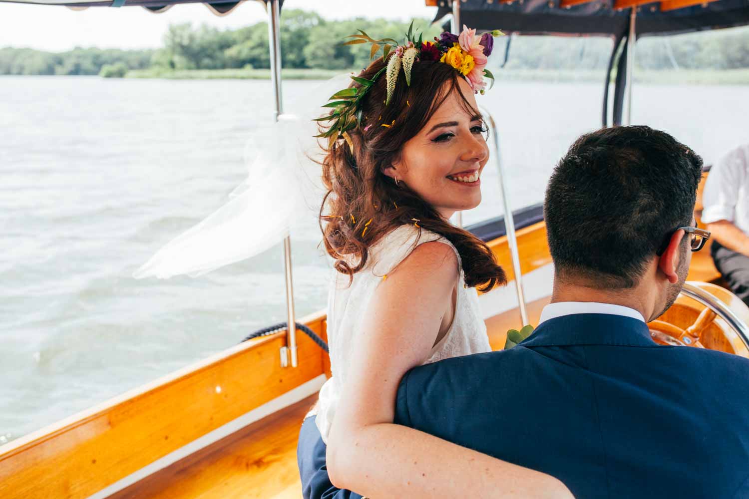 bride on a boat ride at Boathouse Ormsby in norfolk