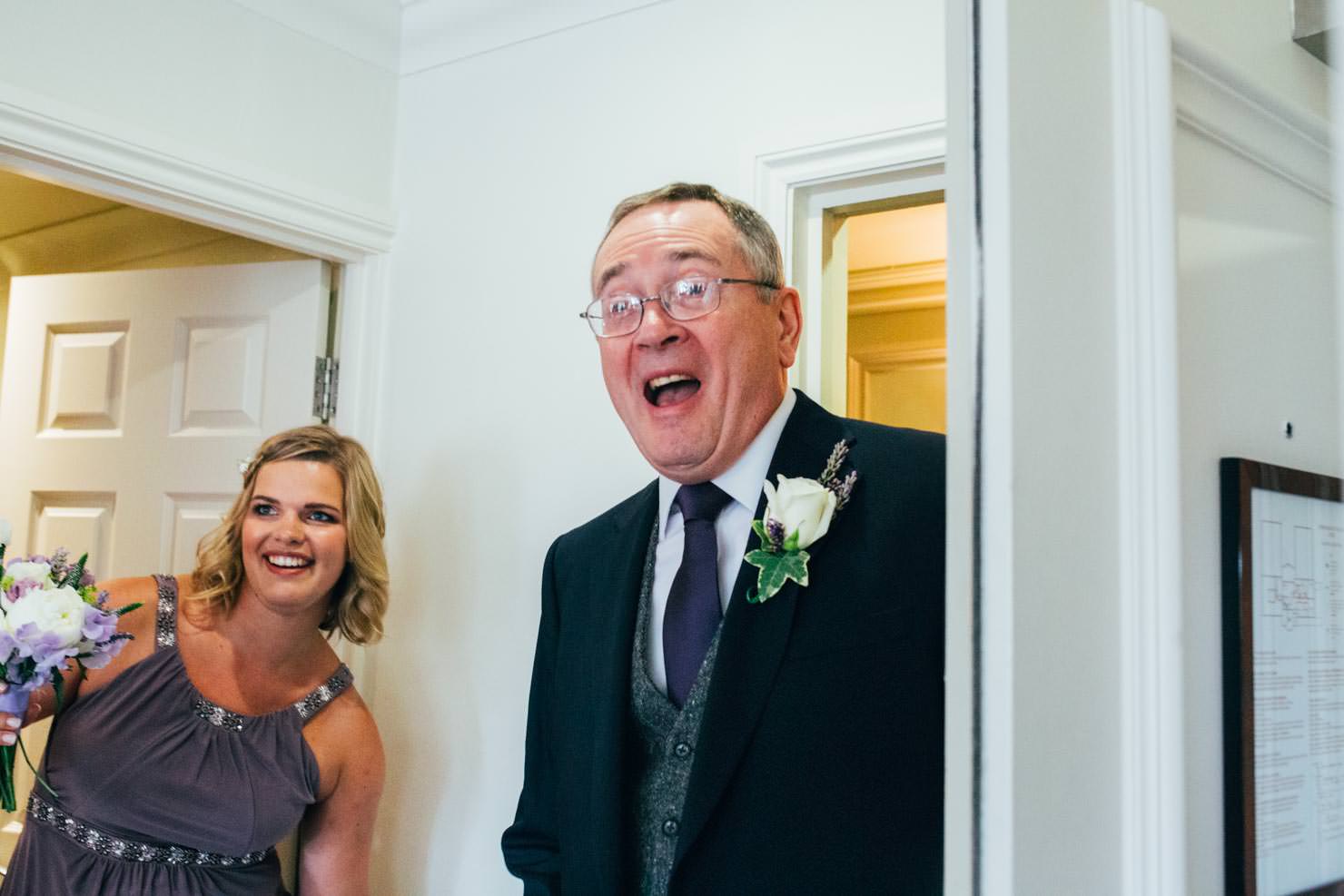happy father of the bride seeing daughter for the first time in suffolk