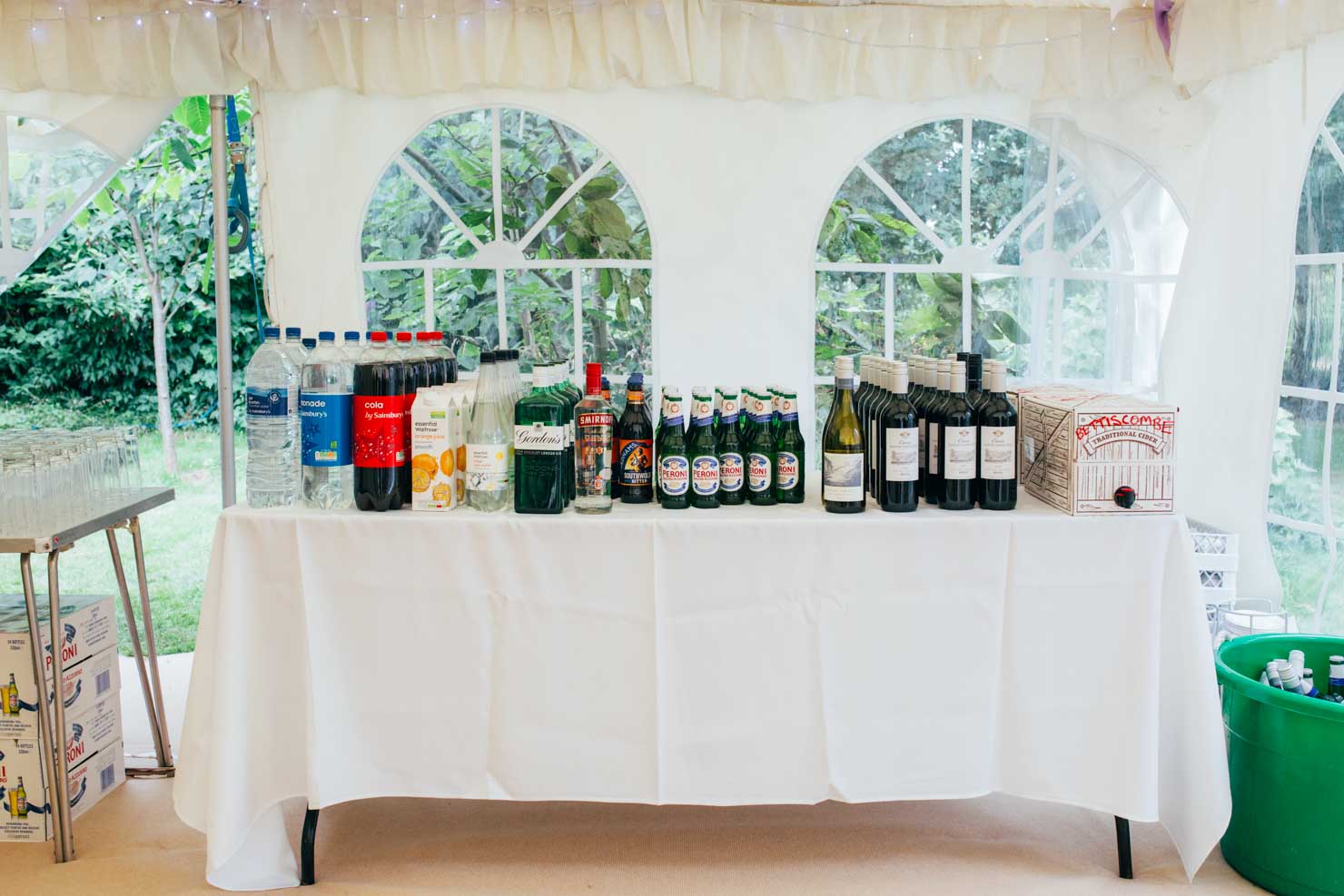 drinks table in marquee wedding reception photography in suffolk