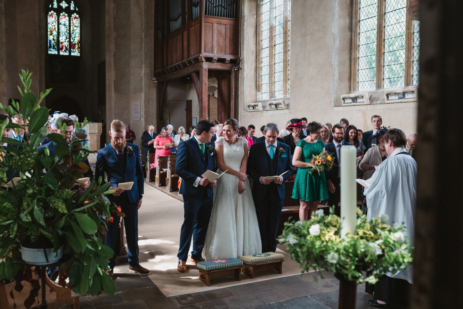 Photography of relaxed bride and groom during their church wedding ceremony