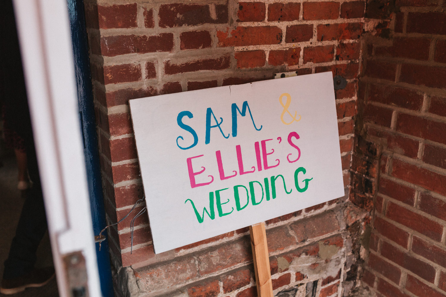 sam and allies wedding sign at norfolk reception party