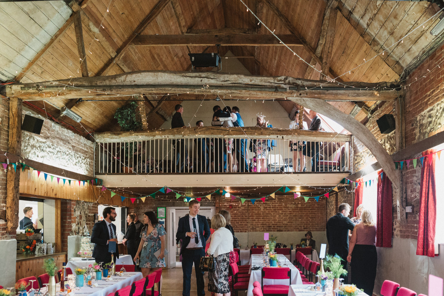 Norfolk suffolk relaxed tithe barn wedding reception colourful DIY decorations