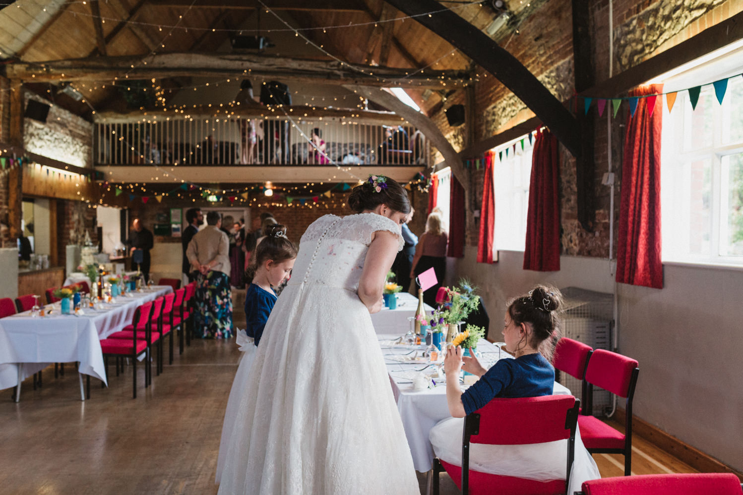 Norfolk suffolk relaxed barn wedding reception colourful DIY decorations bride