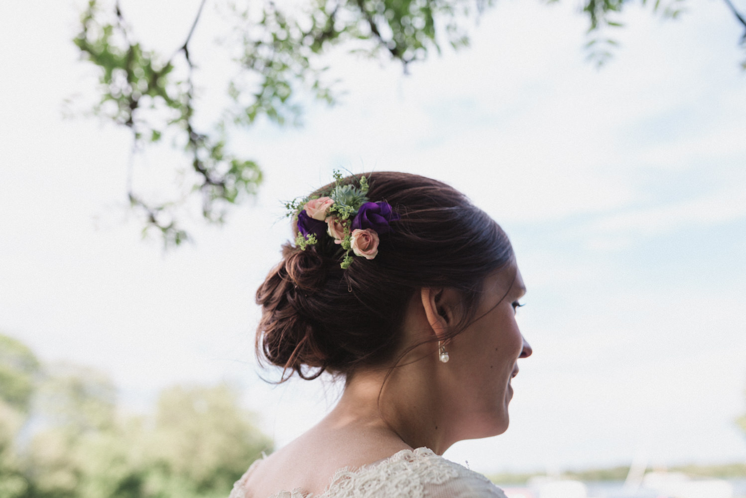 Relaxed bridal portraits in front of water by norfolk wedding photographer emily tyler