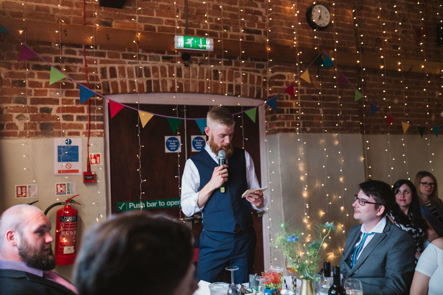 Guests at Norfolk suffolk relaxed tithe barn wedding best man speech
