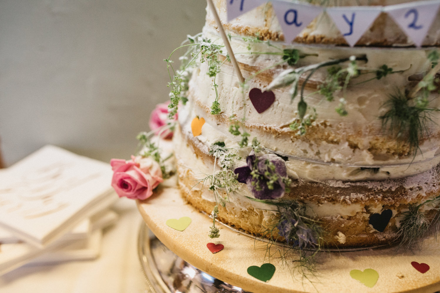 naked vanilla floral wedding cake 