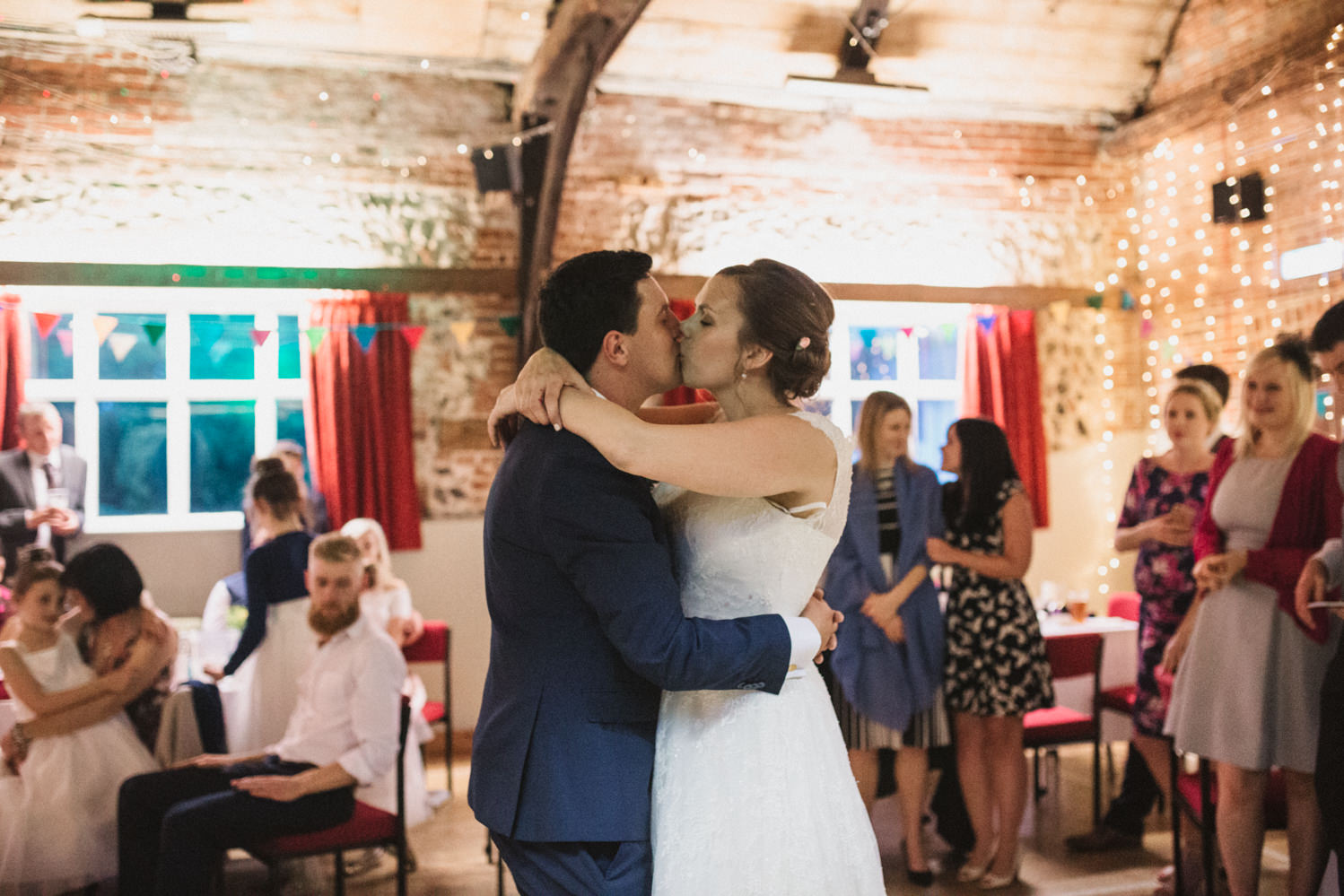 Guests at Norfolk suffolk relaxed tithe barn wedding first dance