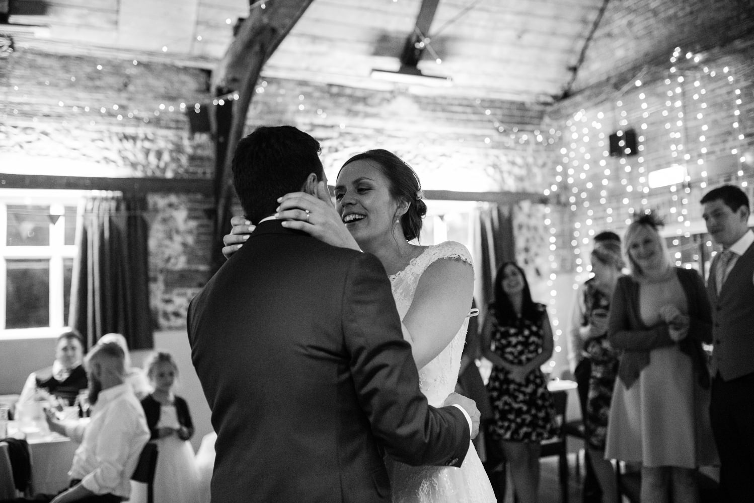 Guests at Norfolk suffolk relaxed tithe barn wedding first dance