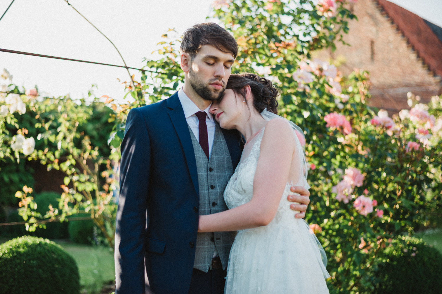 outdoors couples portraits at a natural pretty elms barn wedding in suffolk