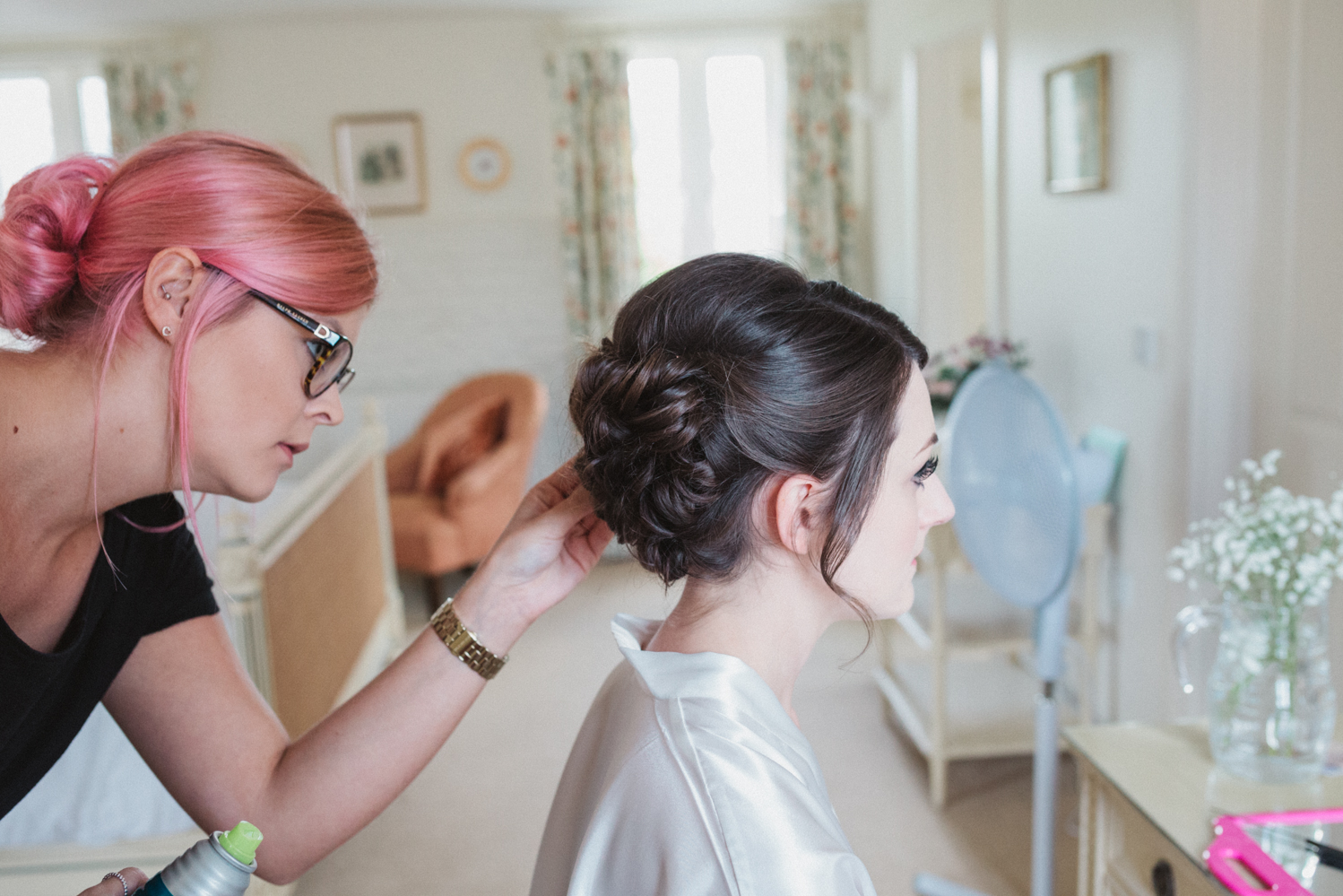 photography of bridal prep at a natural pretty elms barn wedding in suffolk