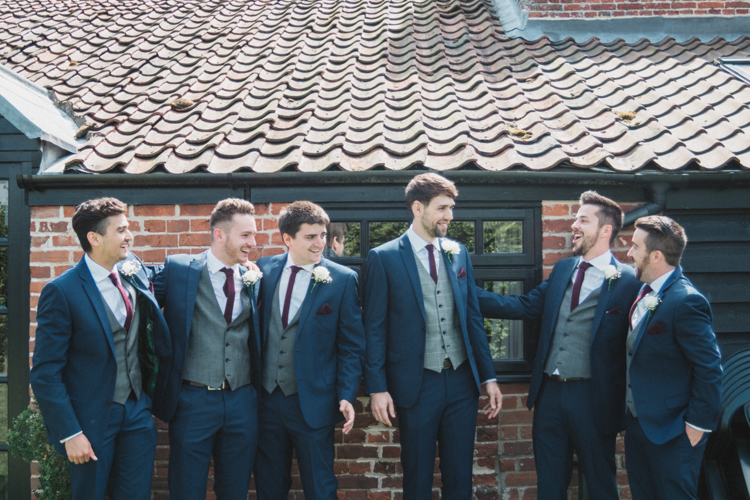 groom and ushers photography at a natural pretty elms barn wedding in suffolk