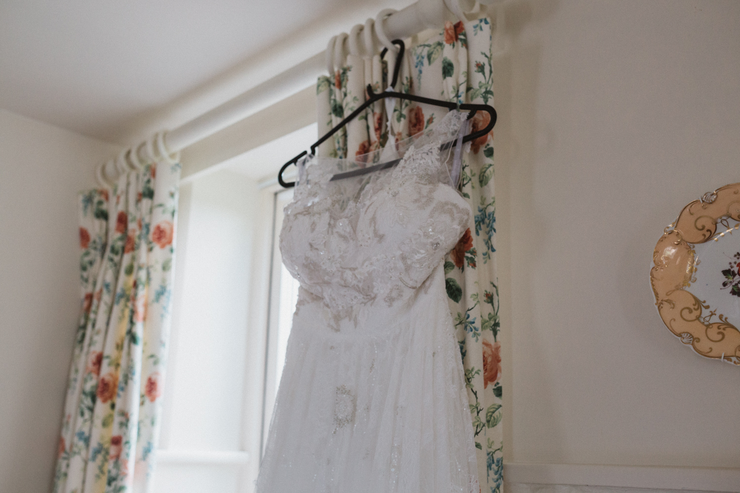 photography of wedding dress at a natural pretty elms barn wedding in suffolk