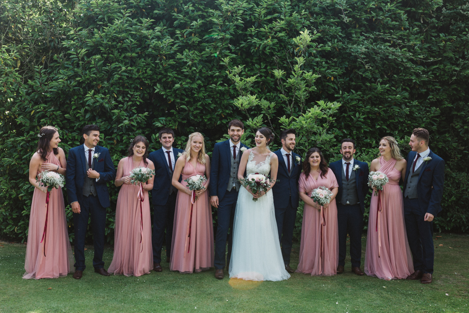 outdoors bridal party portraits at a natural pretty elms barn wedding in suffolk