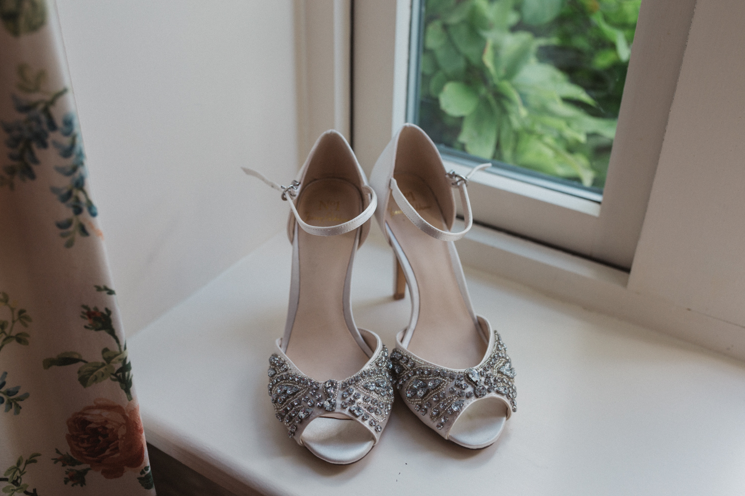 photography of wedding shoes at a natural pretty elms barn wedding in suffolk