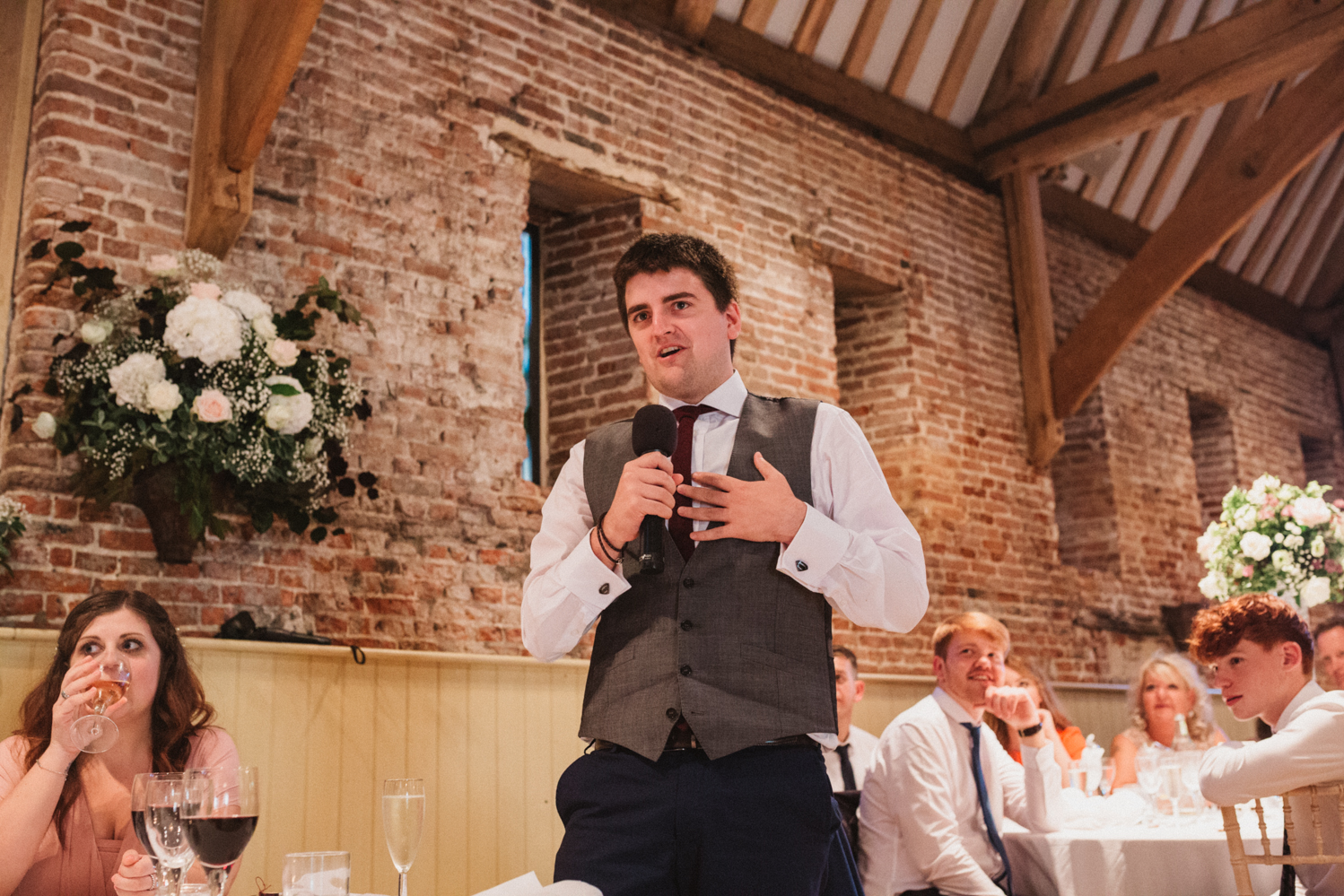 candid guests photography at a natural pretty elms barn wedding in suffolk