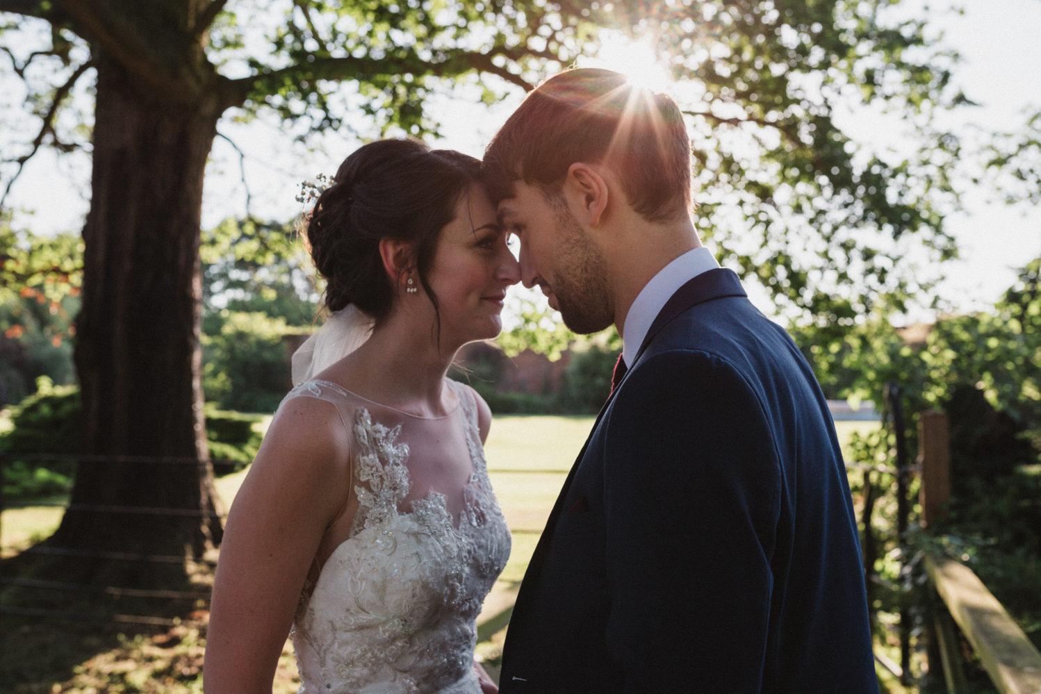 outdoors couples portraits at a natural pretty elms barn wedding in suffolk