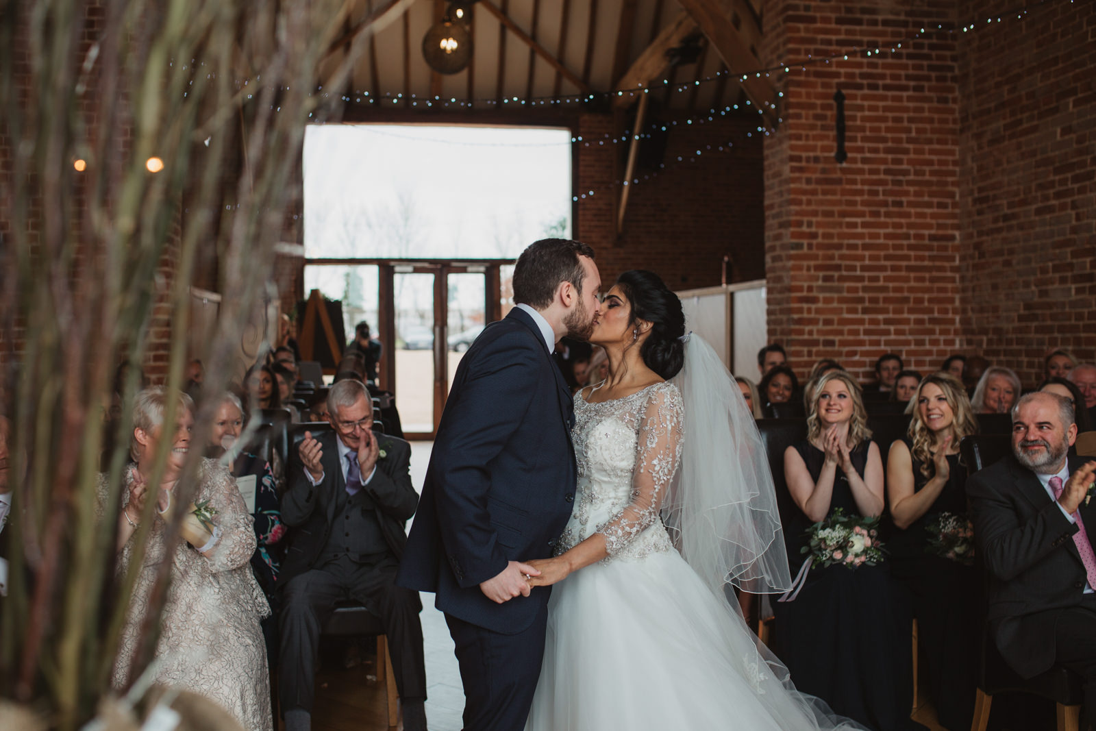 Newlyweds first kiss at relaxed southwood hall wedding