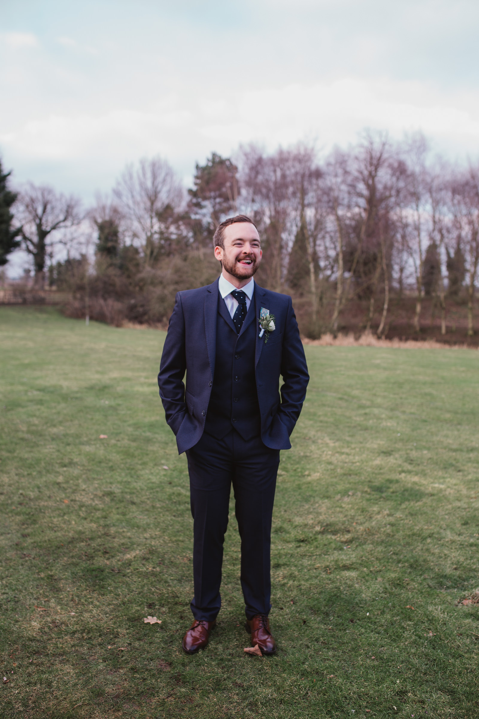 relaxed laughing groom portrait at southwood hall