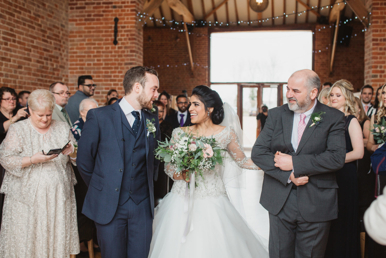 relaxed laughing norfolk couple saying vows at southwood hall