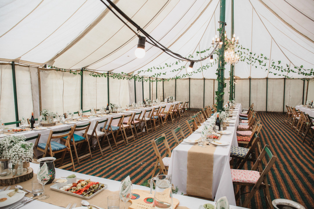 keeper and the dell vintage marquee decorated with ivy and gypsophila