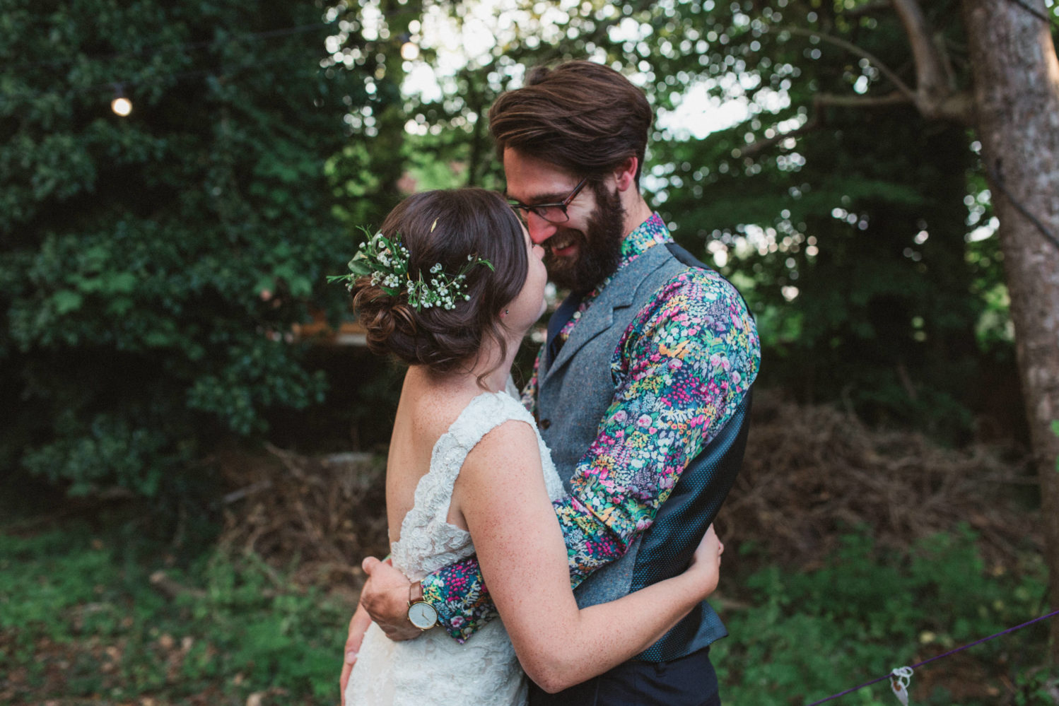 bride and groom hugging in suffolk woodland