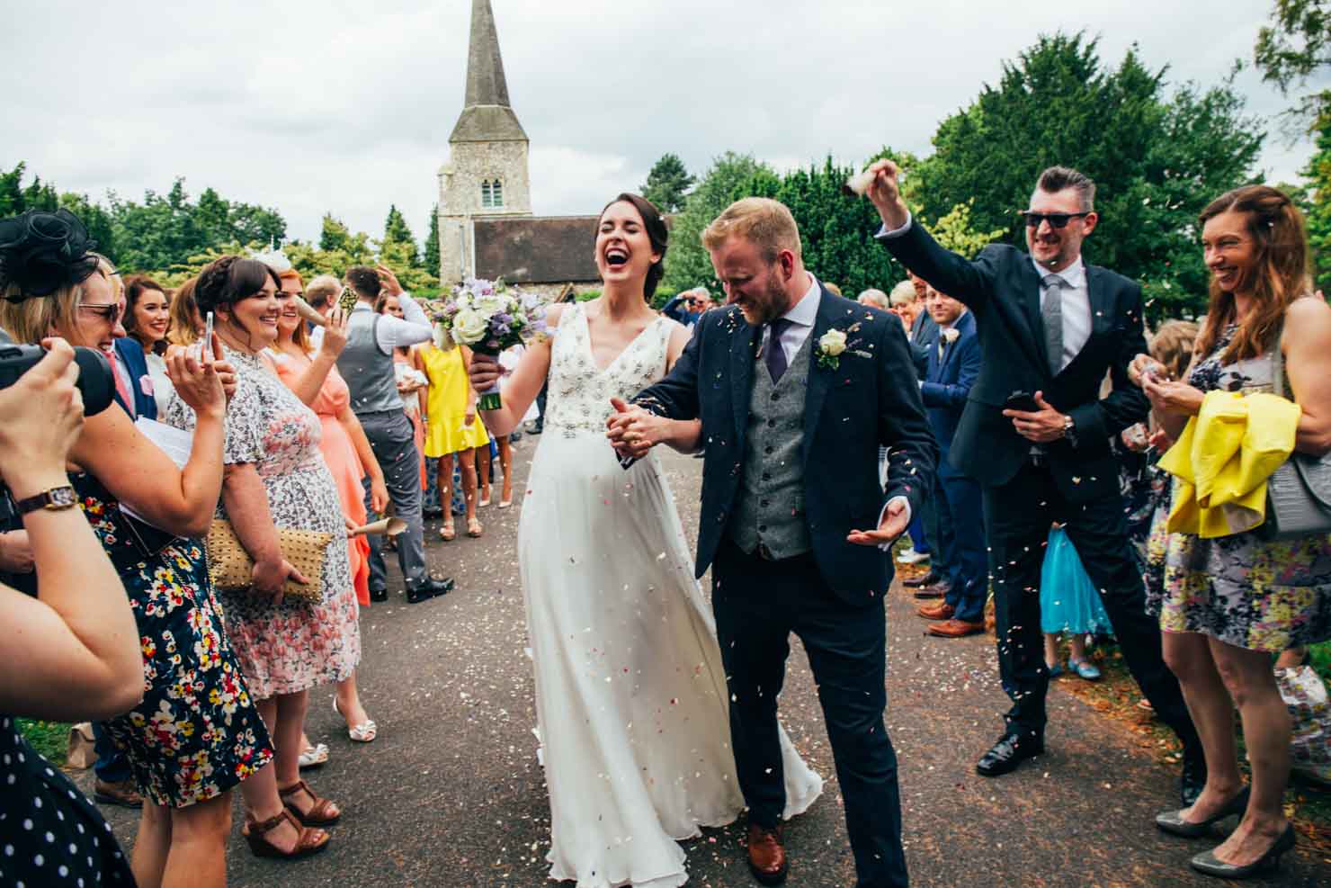 newlyweds down confetti line wedding photography in suffolk