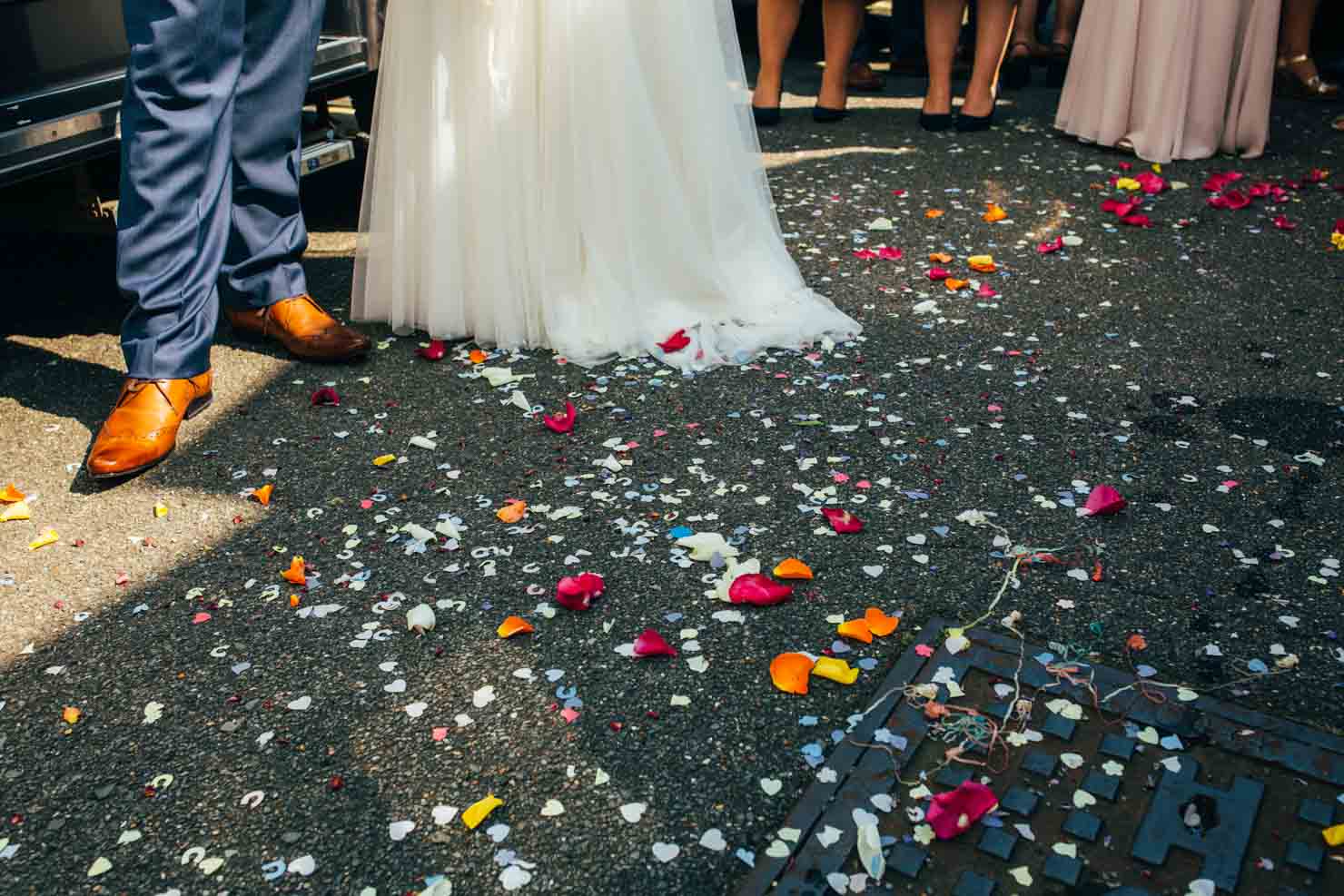 tips for confetti pictures wedding photography colourful confetti on the floor in Ipswich