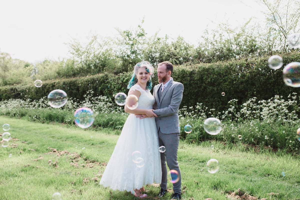 newlyweds surrounded by a giant bubble