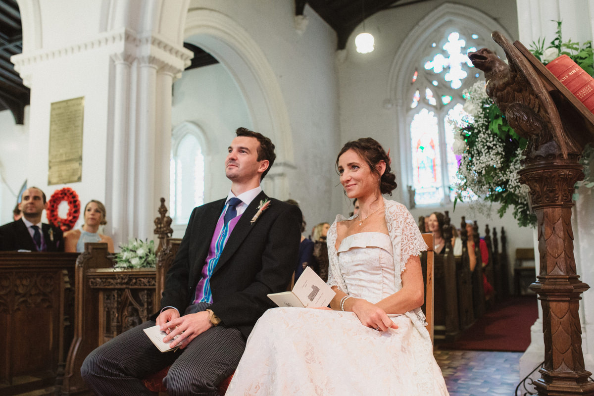 bride and groom smiling at st marys church wedding in eye suffolk