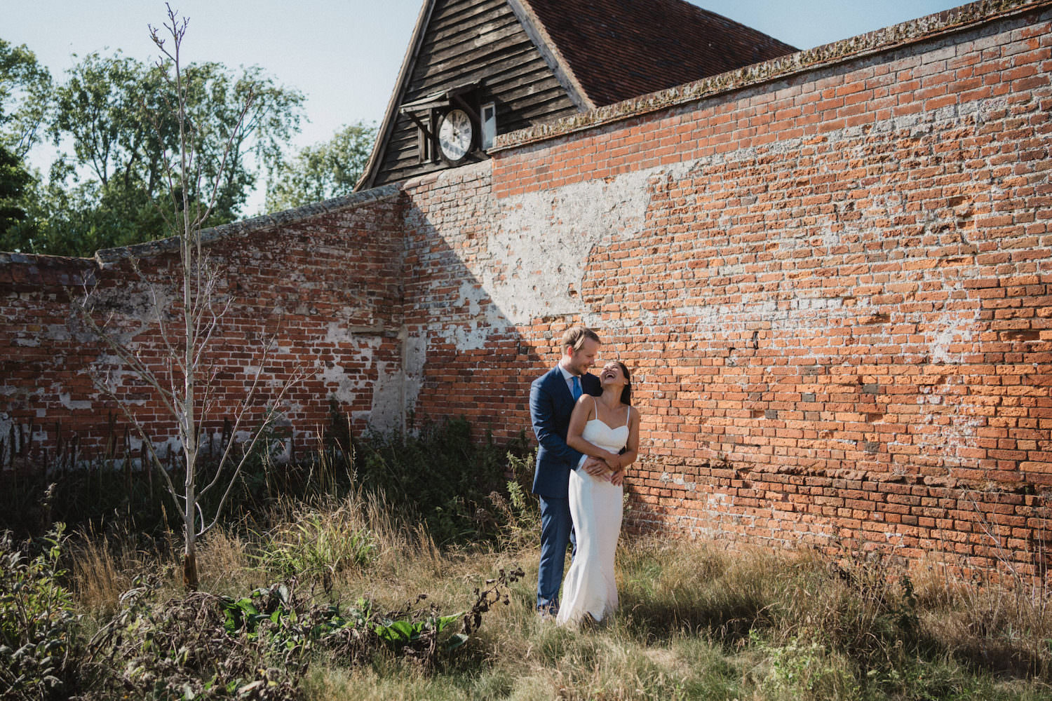 Suffolk Barn wedding photographer relaxed natural laughter